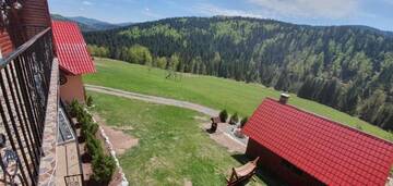 Фото номера Коттедж с 6 спальнями Дома для отпуска Cabana Popasul Vânătorului г. Арьешени 68
