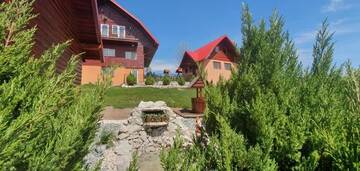 Фото номера Коттедж с 6 спальнями Дома для отпуска Cabana Popasul Vânătorului г. Арьешени 36